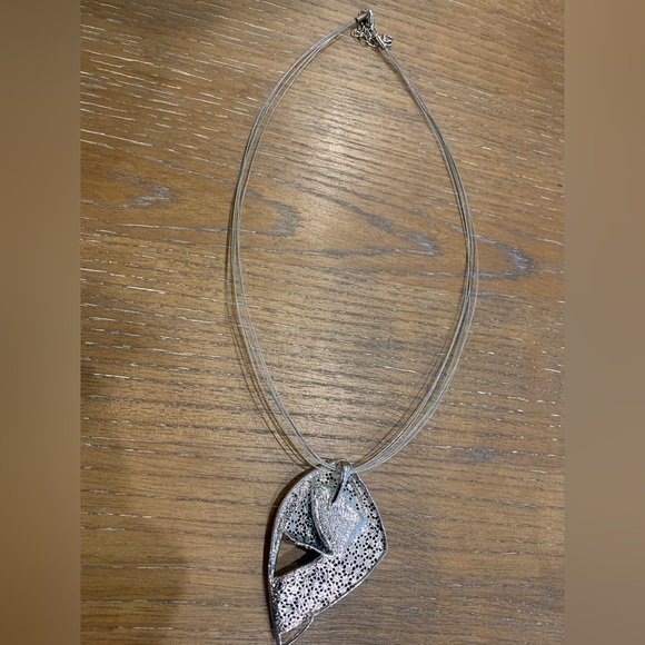 Metal pendant. Geometric pattern under dark amber enamel. Retro design on wire - Picture 6 of 6